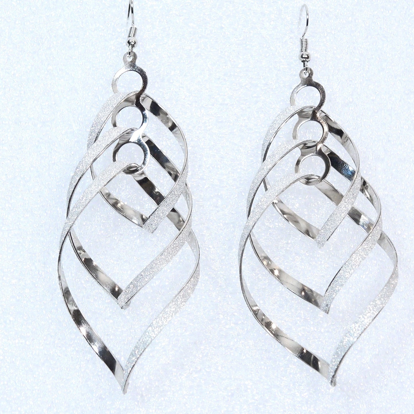OL spiral silver toned uniquely shaped earrings — Free Shipping